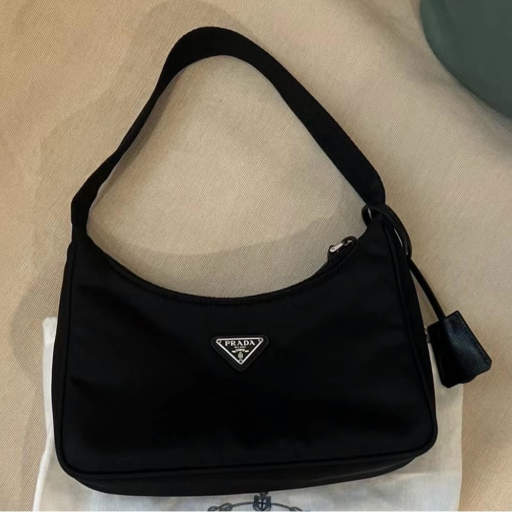 Re-Edition 2000 mini-bag is made of innovative Re-Ny.